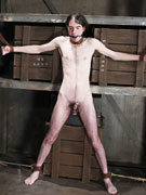 Male slave bound to the wall